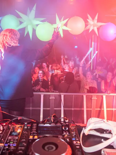 A DJ playing under a ceiling of stars